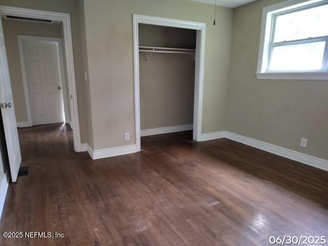 7228 Zona Ave, Jacksonville, FL 32211 - unfurnished bedroom with wood finished floors and a closet