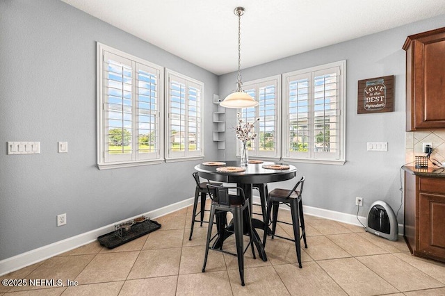 11598 Wynnfield Lakes Cir, Jacksonville, FL 32246 - dining room with plenty of natural light and light tile patterned floors
