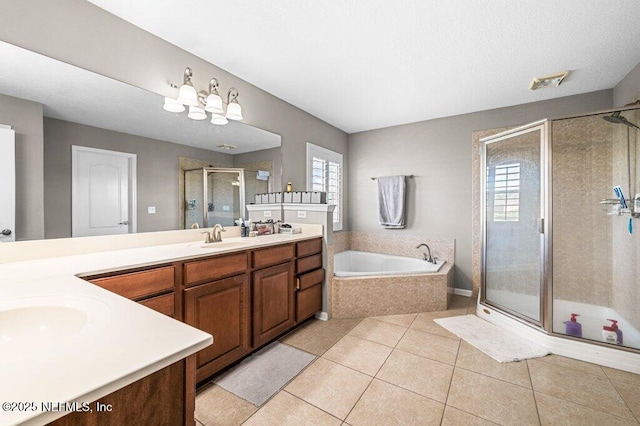 11598 Wynnfield Lakes Cir, Jacksonville, FL 32246 - full bathroom featuring double vanity, a stall shower, a bath, and tile patterned floors