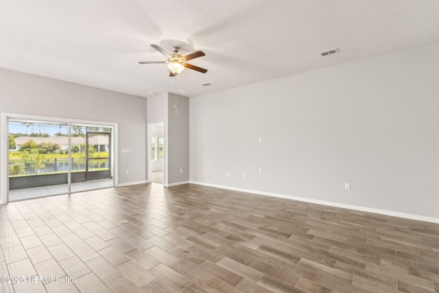 83687 Nether St, Fernandina Beach, FL 32034 - unfurnished room with ceiling fan, wood finished floors, and a textured ceiling