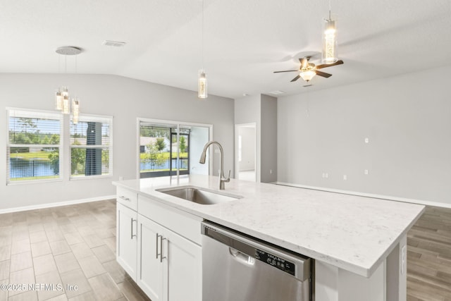 83687 Nether St, Fernandina Beach, FL 32034 - kitchen featuring stainless steel dishwasher, a center island with sink, ceiling fan, open floor plan, and white cabinets