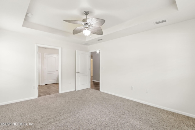 83687 Nether St, Fernandina Beach, FL 32034 - unfurnished bedroom with a raised ceiling, carpet, and ceiling fan