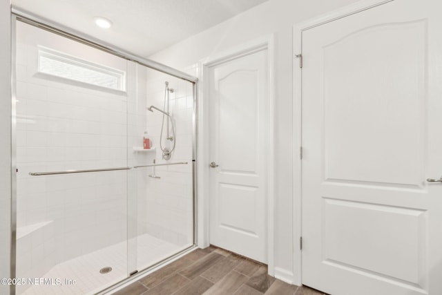 83687 Nether St, Fernandina Beach, FL 32034 - full bathroom featuring a shower stall and wood finish floors