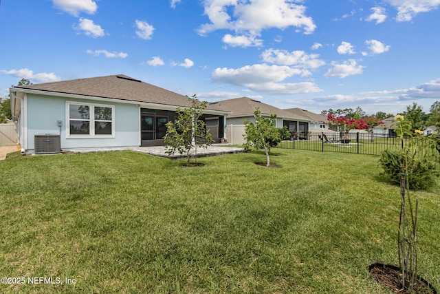 83687 Nether St, Fernandina Beach, FL 32034 - rear view of house with a fenced backyard, a patio, stucco siding, a garage, and roof with shingles