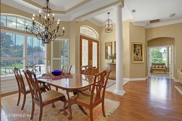 1521 Nottingham Knoll Dr, Jacksonville, FL 32225 - dining room with a chandelier, ornamental molding, wood finished floors, french doors, and ornate columns