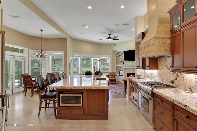 1521 Nottingham Knoll Dr, Jacksonville, FL 32225 - kitchen featuring appliances with stainless steel finishes, premium range hood, recessed lighting, a ceiling fan, and decorative backsplash