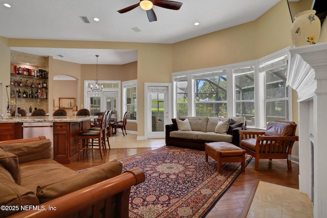 1521 Nottingham Knoll Dr, Jacksonville, FL 32225 - living room featuring a ceiling fan, light wood-style floors, recessed lighting, and a chandelier