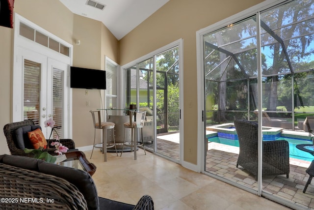 1521 Nottingham Knoll Dr, Jacksonville, FL 32225 - entryway with a sunroom, french doors, tile patterned floors, and high vaulted ceiling