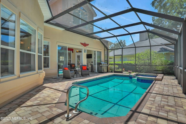 1521 Nottingham Knoll Dr, Jacksonville, FL 32225 - view of swimming pool featuring a patio area, a pool with connected hot tub, grilling area, and a lanai