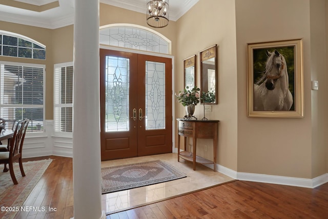 1521 Nottingham Knoll Dr, Jacksonville, FL 32225 - entrance foyer featuring french doors, hardwood / wood-style floors, healthy amount of natural light, a chandelier, and ornamental molding