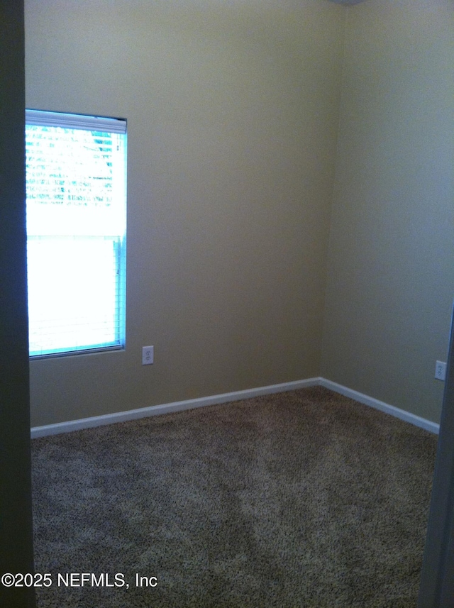 9556 Armelle Way Unit 2, Jacksonville, FL 32257 - unfurnished room with healthy amount of natural light and carpet
