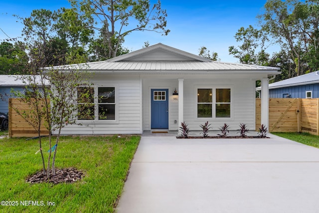 981 Butler Ave, Saint Augustine, FL 32084 - view of front facade featuring covered porch and a metal roof