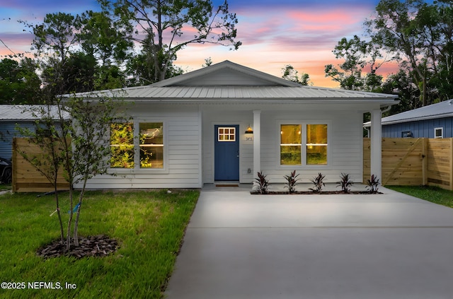 981 Butler Ave, Saint Augustine, FL 32084 - view of front of property with a porch, a metal roof, and driveway
