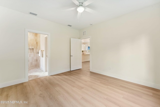 981 Butler Ave, Saint Augustine, FL 32084 - unfurnished bedroom featuring light wood-type flooring and connected bathroom