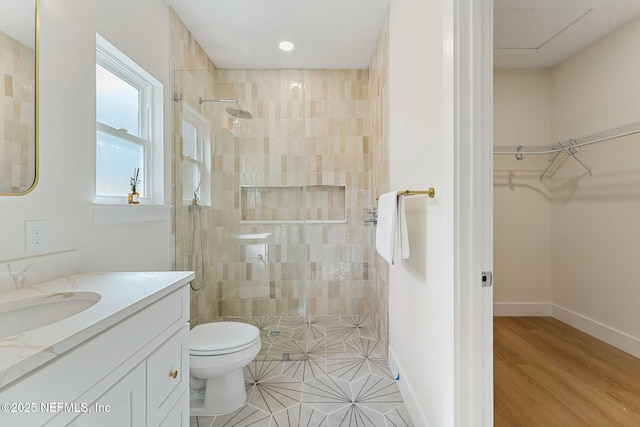 981 Butler Ave, Saint Augustine, FL 32084 - full bath featuring walk in shower, vanity, a walk in closet, and wood finished floors
