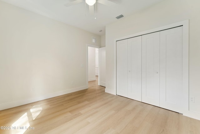 981 Butler Ave, Saint Augustine, FL 32084 - unfurnished bedroom featuring light wood-type flooring, a closet, and a ceiling fan