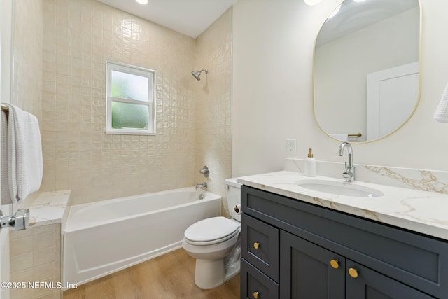 981 Butler Ave, Saint Augustine, FL 32084 - full bath featuring vanity, wood finished floors, and washtub / shower combination
