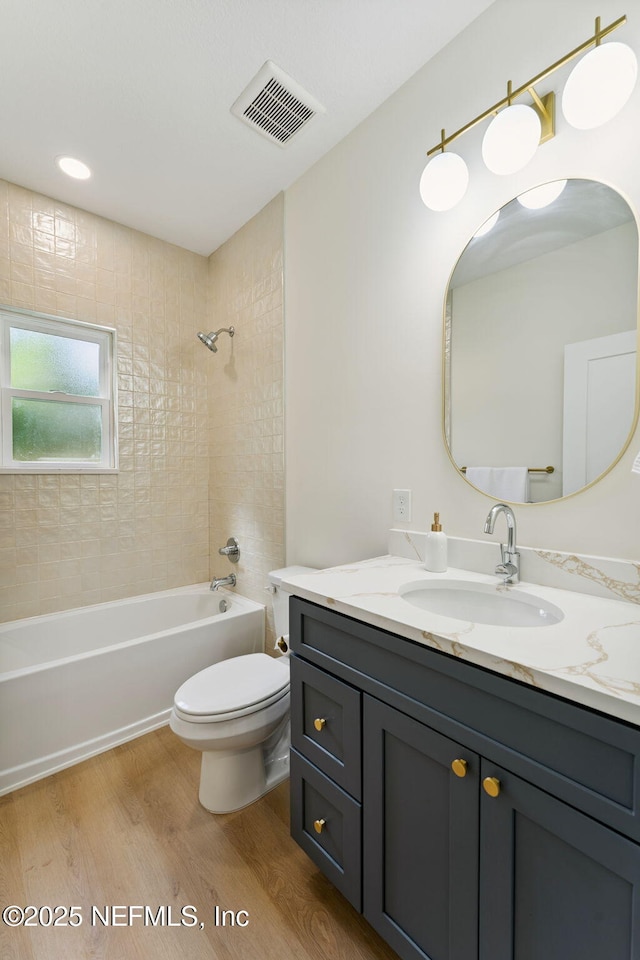 981 Butler Ave, Saint Augustine, FL 32084 - bathroom with vanity, wood finished floors, and shower / bath combination