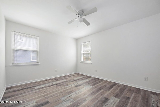 631-633 Main St, Atlantic Beach, FL 32233 - empty room with wood finished floors and ceiling fan