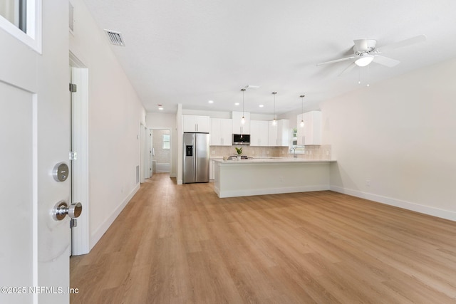 989 Butler Ave, Saint Augustine, FL 32084 - unfurnished living room with light wood-style flooring, ceiling fan, and recessed lighting