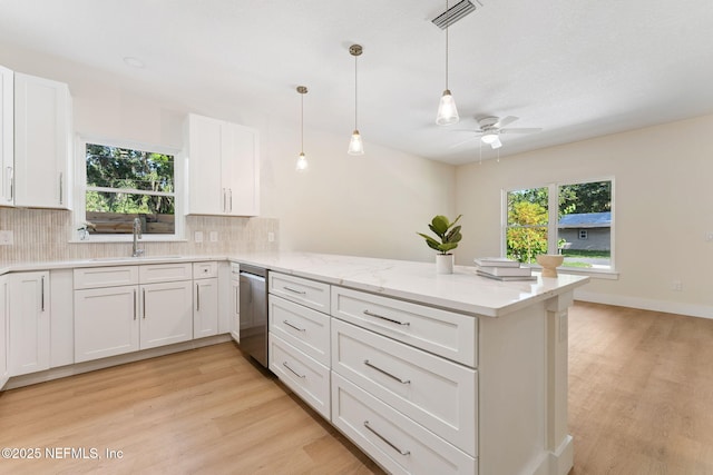 989 Butler Ave, Saint Augustine, FL 32084 - kitchen featuring a peninsula, dishwasher, a ceiling fan, and light wood-type flooring