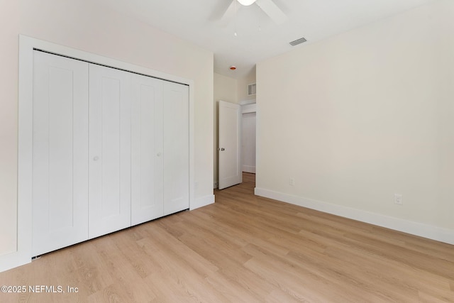 989 Butler Ave, Saint Augustine, FL 32084 - unfurnished bedroom with light wood-style floors, a closet, and ceiling fan