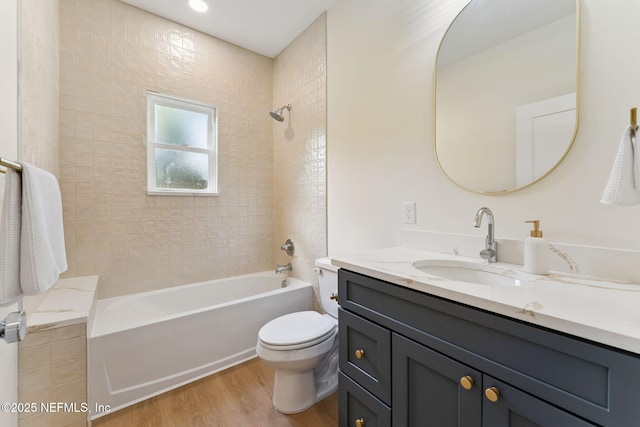 989 Butler Ave, Saint Augustine, FL 32084 - full bath with vanity, wood finished floors, and shower / tub combination