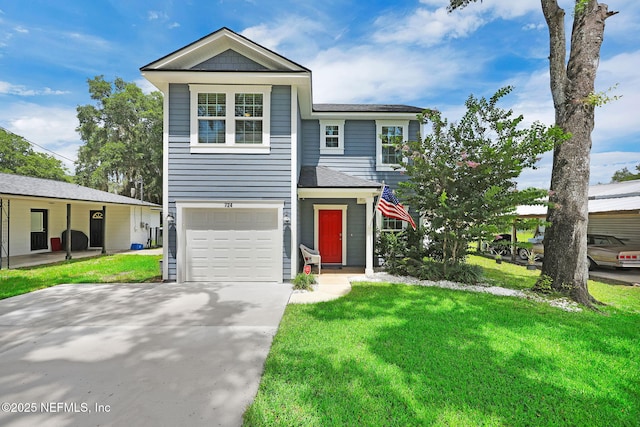 724 N Pine Ave, Green Cove Springs, FL 32043 - view of front of home featuring an attached garage, a front yard, and driveway