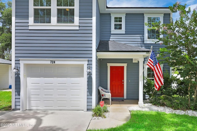 724 N Pine Ave, Green Cove Springs, FL 32043 - view of front of property featuring a garage, driveway, and a shingled roof