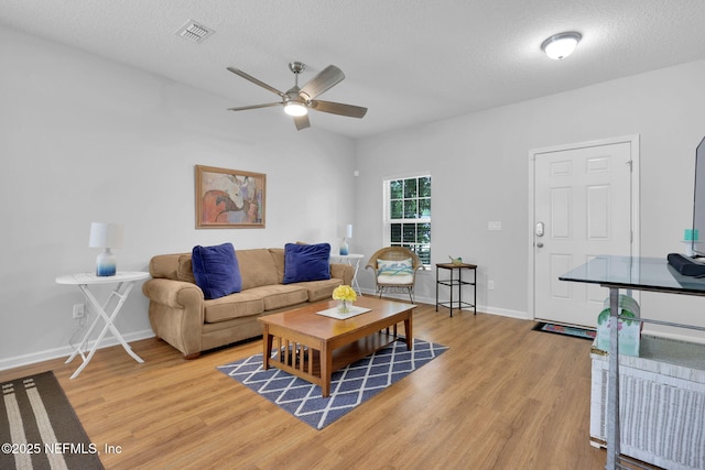 724 N Pine Ave, Green Cove Springs, FL 32043 - living area featuring ceiling fan, light wood finished floors, and a textured ceiling