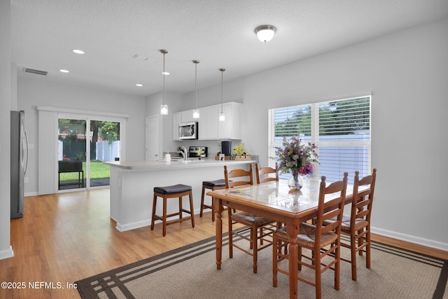 724 N Pine Ave, Green Cove Springs, FL 32043 - dining room featuring plenty of natural light, light wood-type flooring, and recessed lighting