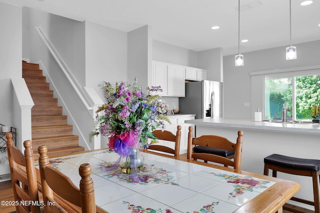 724 N Pine Ave, Green Cove Springs, FL 32043 - dining room with stairway, recessed lighting, and wood finished floors