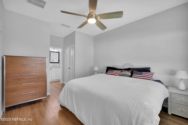 724 N Pine Ave, Green Cove Springs, FL 32043 - bedroom featuring wood finished floors, ensuite bath, a ceiling fan, and vaulted ceiling