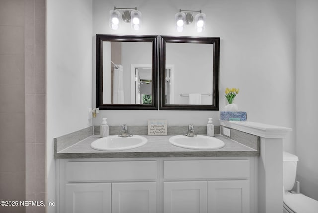 724 N Pine Ave, Green Cove Springs, FL 32043 - bathroom featuring double vanity and toilet