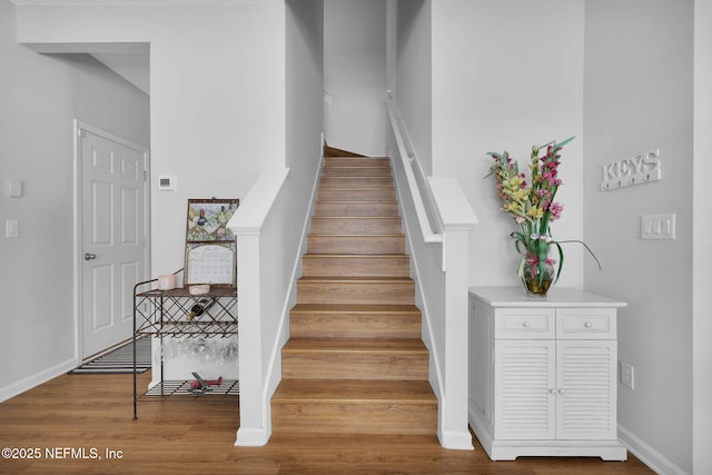 724 N Pine Ave, Green Cove Springs, FL 32043 - stairway with wood finished floors and baseboards