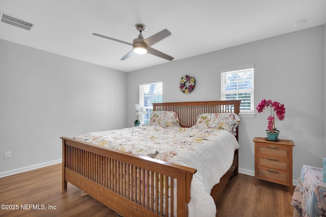 724 N Pine Ave, Green Cove Springs, FL 32043 - bedroom with wood finished floors and ceiling fan