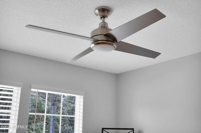 724 N Pine Ave, Green Cove Springs, FL 32043 - detailed view of a textured ceiling and ceiling fan