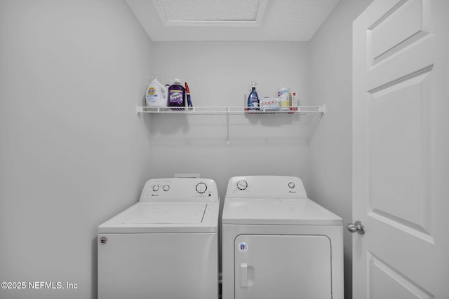 724 N Pine Ave, Green Cove Springs, FL 32043 - washroom with washer and clothes dryer and a textured ceiling