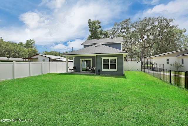 724 N Pine Ave, Green Cove Springs, FL 32043 - back of house featuring a fenced backyard, roof with shingles, a gate, and a patio
