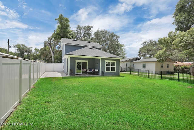 724 N Pine Ave, Green Cove Springs, FL 32043 - rear view of property with a patio, a shingled roof, and a fenced backyard