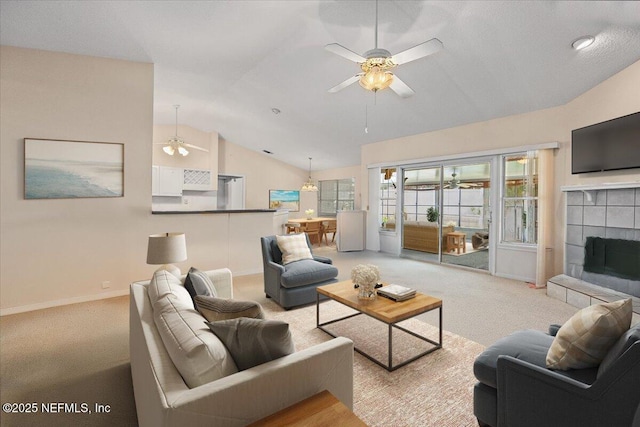 1121 Linkside Ct E, Atlantic Beach, FL 32233 - living room with ceiling fan, vaulted ceiling, a tile fireplace, and light carpet