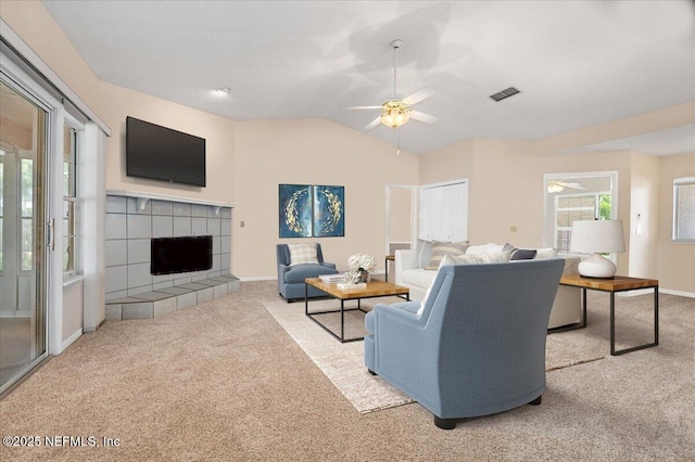 1121 Linkside Ct E, Atlantic Beach, FL 32233 - living room with carpet, ceiling fan, a tile fireplace, and lofted ceiling