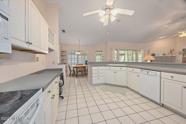 1121 Linkside Ct E, Atlantic Beach, FL 32233 - kitchen featuring white appliances, a ceiling fan, white cabinetry, vaulted ceiling, and light tile patterned floors