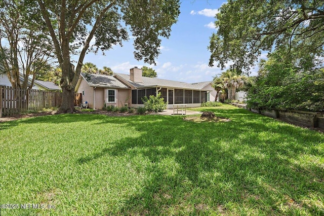 1121 Linkside Ct E, Atlantic Beach, FL 32233 - back of property featuring a sunroom, a chimney, and stucco siding