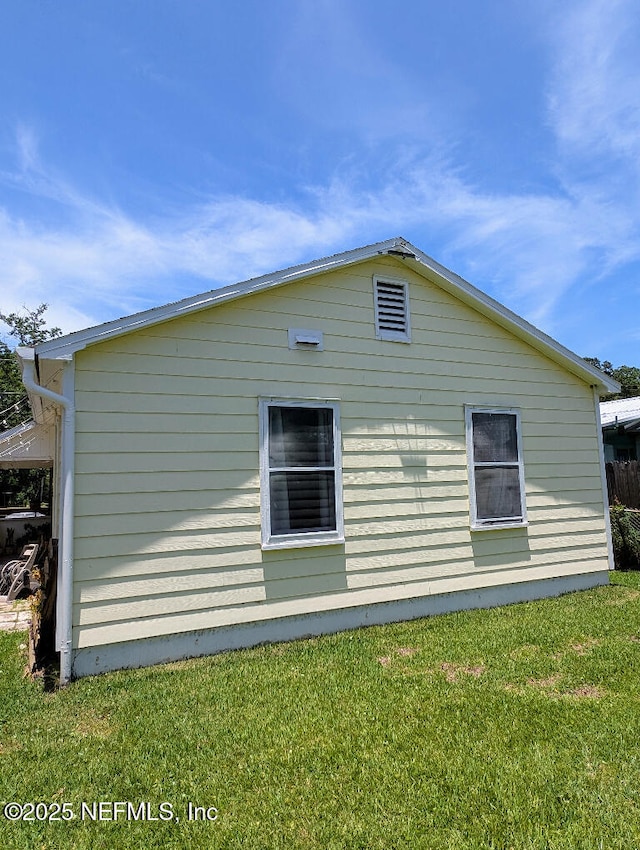 217 Covino Ave, Saint Augustine, FL 32084 - view of side of home featuring a lawn