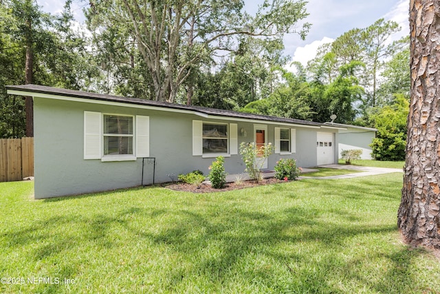 175 Evergreen Ln, Middleburg, FL 32068 - single story home featuring stucco siding, driveway, and a garage