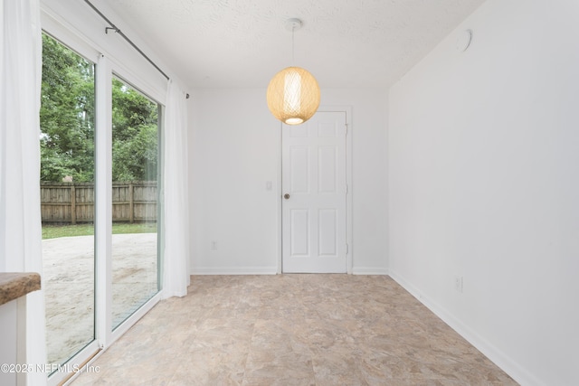 175 Evergreen Ln, Middleburg, FL 32068 - unfurnished dining area with a textured ceiling