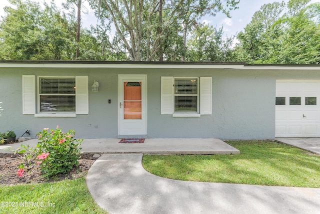 175 Evergreen Ln, Middleburg, FL 32068 - single story home featuring an attached garage, a porch, and stucco siding
