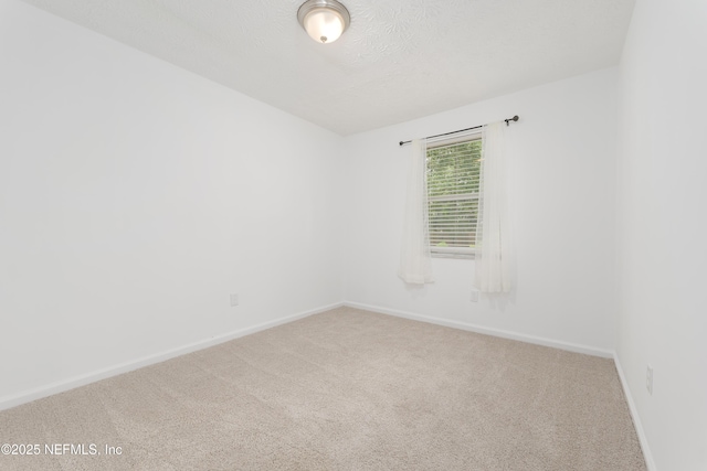 175 Evergreen Ln, Middleburg, FL 32068 - carpeted empty room featuring baseboards and a textured ceiling
