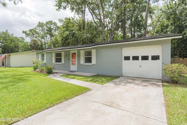 175 Evergreen Ln, Middleburg, FL 32068 - single story home with driveway, stucco siding, a garage, and a front lawn